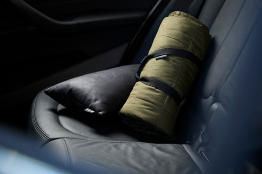 autonomy blanket pictured on a leather seat at the back of a car