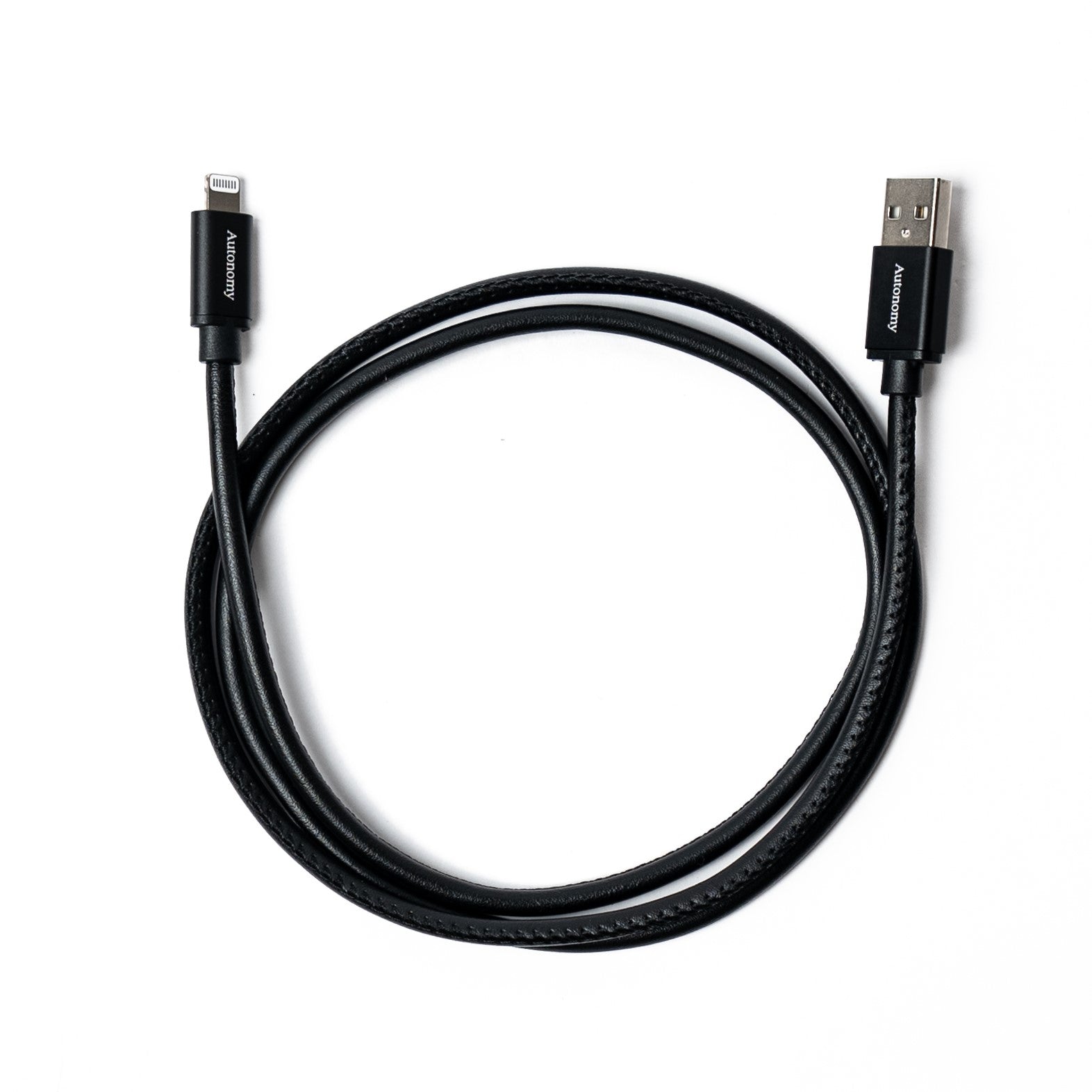 Black autonomy branded usb iphone charger cable on a white background